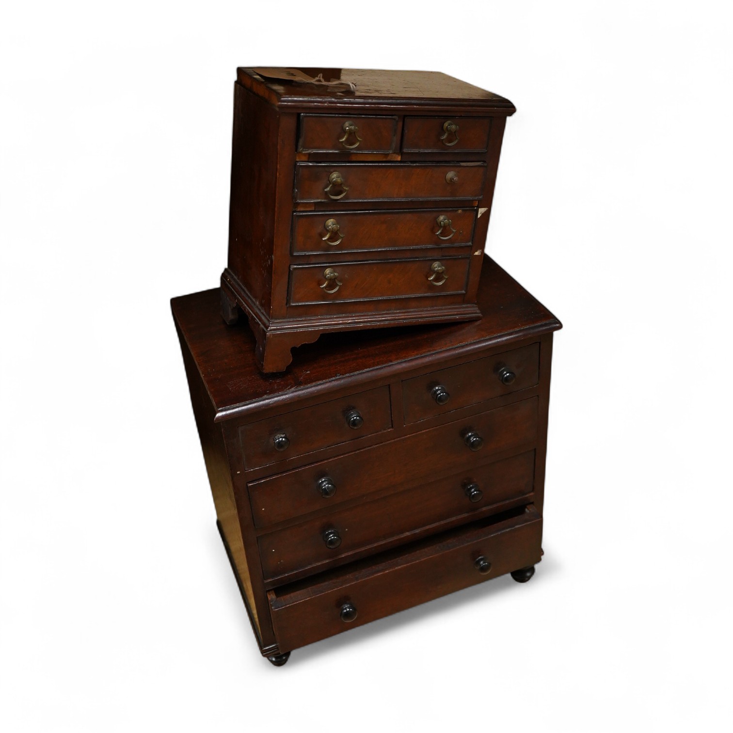 Two 19th century miniature mahogany chests of drawers, largest 29cm wide